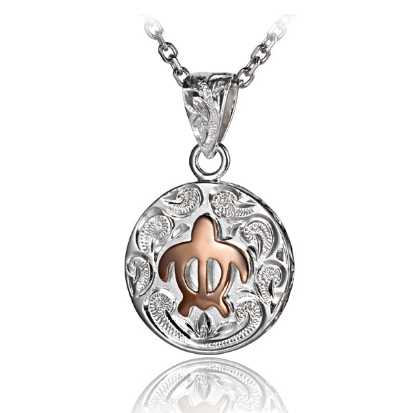The picture is a sterling silver scroll medallion pendant with a rose gold vermeil sea turtle design. 