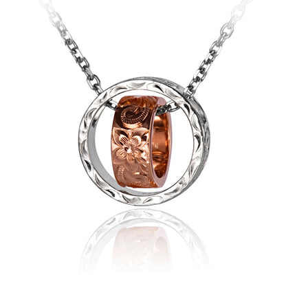 The photo is a two-tone white and rose gold vermeil scroll circle pendant featuring a ring design. 