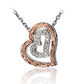 The photo shows a 925 sterling silver two-tone scroll heart pendant featuring clear eco-gems. 