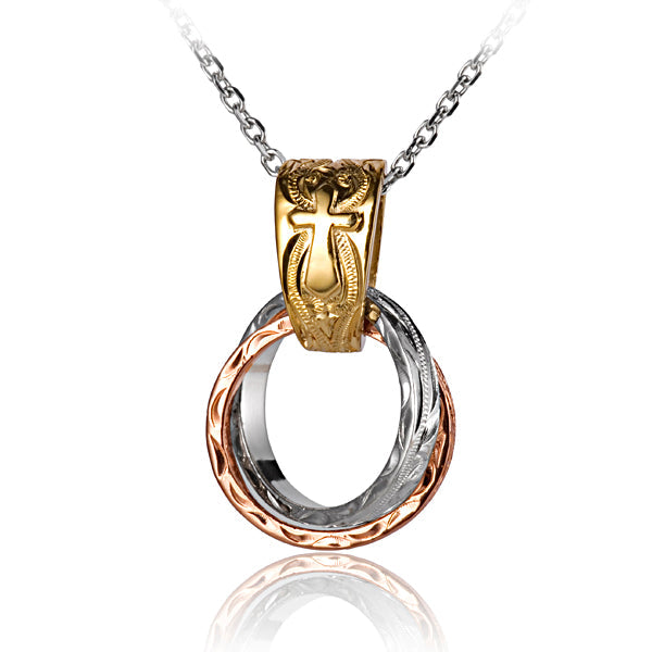The photo shows a three-tone yellow, rose, white gold vermeil pendant with two circles and a cross scroll design. 