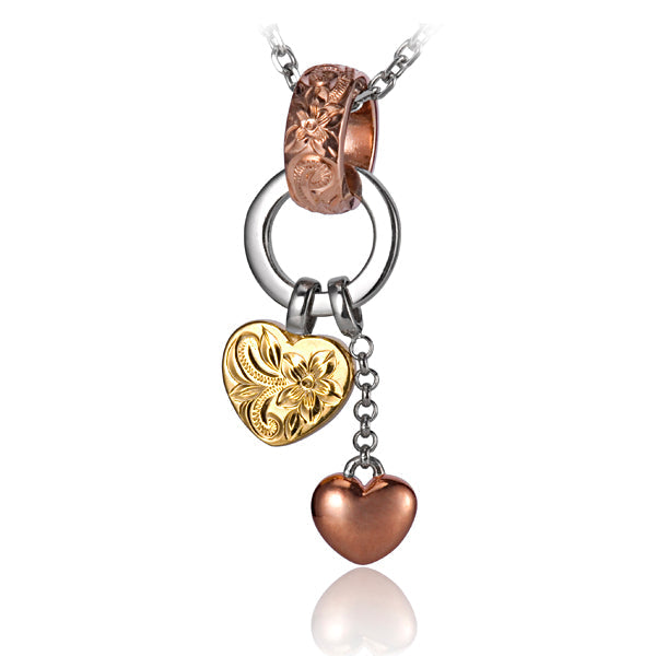 The picture shows a three-tone gold vermeil scroll bell two heart pendant.