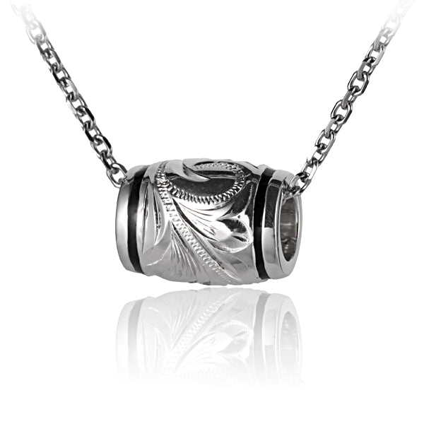 The picture shows a sterling silver engraving barrel pendant in a medium size. 