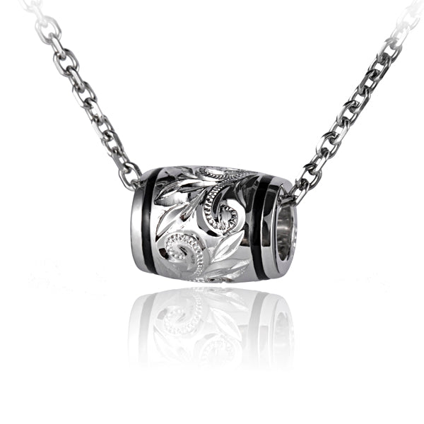 The picture shows a sterling silver engraving barrel pendant in a medium size. 