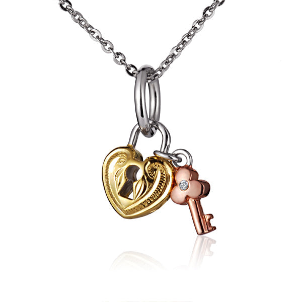 The picture shows a yellow gold vermeil scroll heart with a rose gold vermeil key pendant.