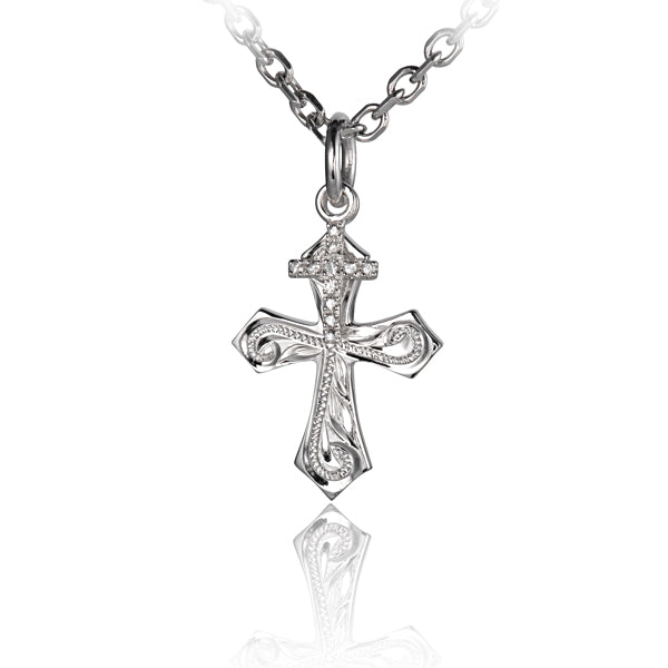 The photo is a small sterling silver cross pendant with cubic zirconia. 