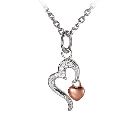 The photo shows a sterling silver rose gold vermeil heart pendant with an open heart shape motif. 