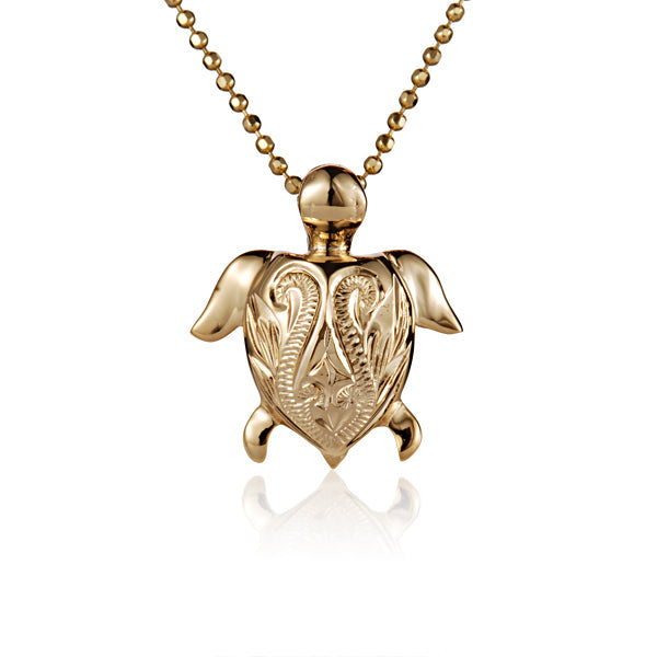 The photo is a small yellow gold vermeil turtle scroll pendant.
