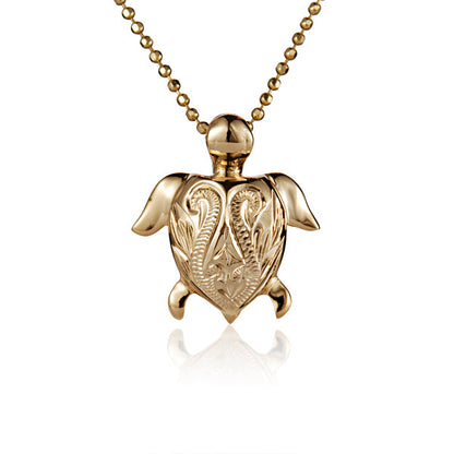 The photo is a small yellow gold vermeil turtle scroll pendant.
