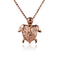 The photo is a small rose gold vermeil turtle scroll pendant.