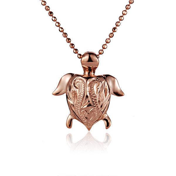 The photo is a small rose gold vermeil turtle scroll pendant.
