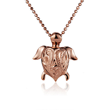 The photo is a small rose gold vermeil turtle scroll pendant.