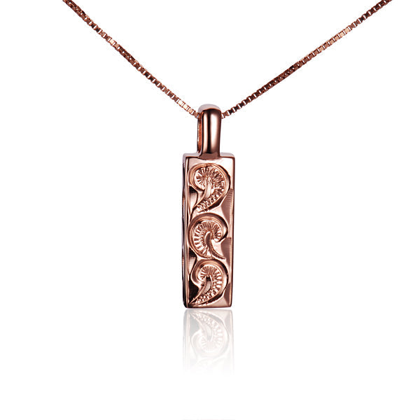 The picture shows a rose gold vermeil Hawaiian wave scroll pendant.