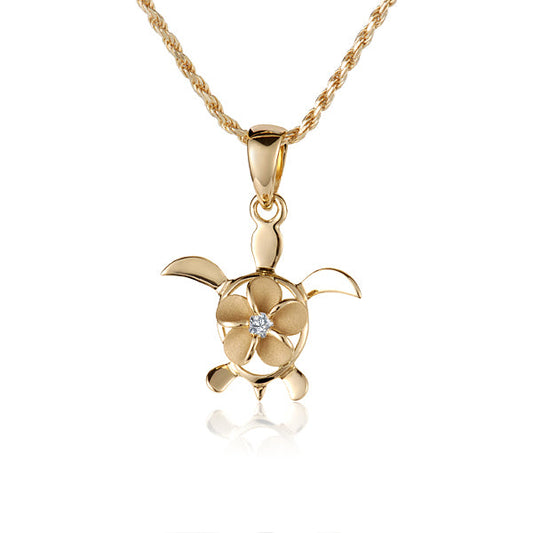 The picture shows a 14K yellow gold plumeria turtle with cubic zirconia.