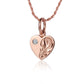 The photo shows a 14K rose gold heart engraved pendant with a cubic zirconia. 