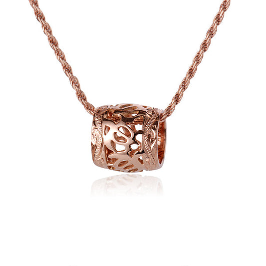 The photo shows a 14K rose gold sea turtle scroll edge barrel pendant.