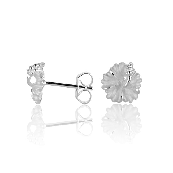 The photo shows a pair of sterling silver white hibiscus stud earrings. 
