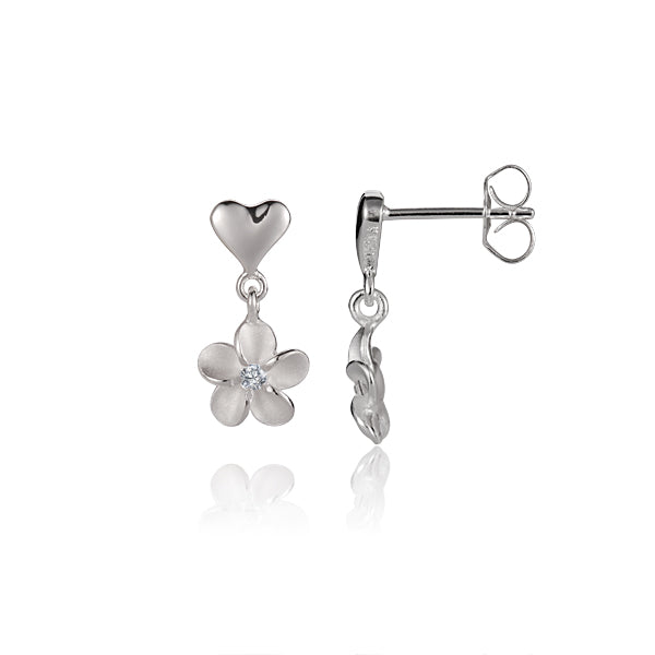 The picture shows a pair of white gold vermeil heart stud earrings featuring a plumeria design with cubic zirconia.