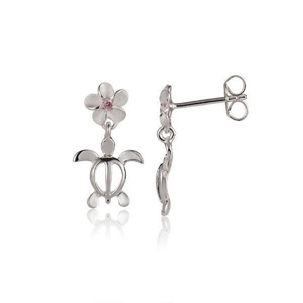The picture shows a pair of sterling silver vermeil plumeria earrings featuring a sea turtle design and a pink cubic zirconia gem. 