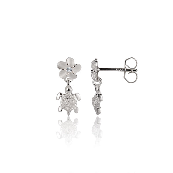 The photo shows a pair of sterling silver flower stud earrings featuring a sea turtle motif with cubic zirconia gems.