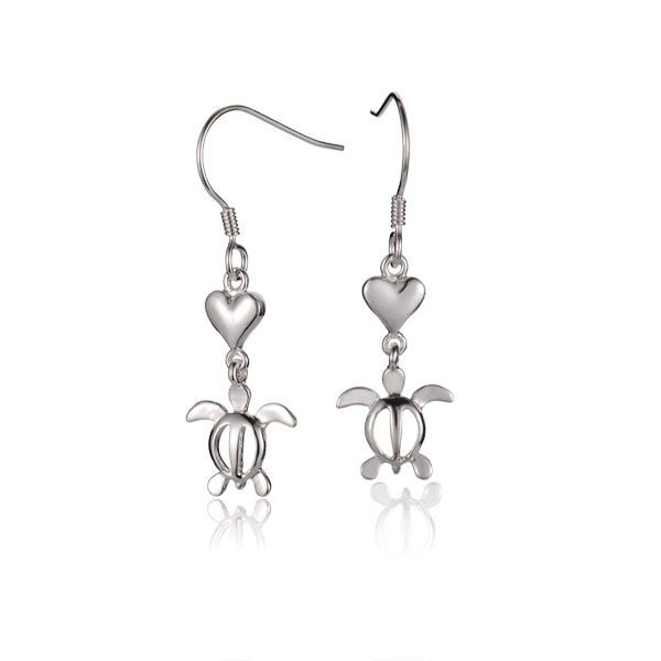 The photo shows a pair of white  gold vermeil heart earrings featuring a sea turtle motif. 