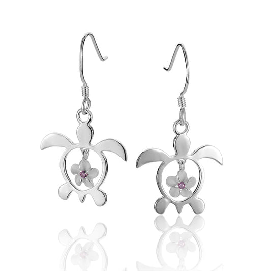 The photo show 6 mm sterling silver sea turtle hook earrings featuring a plumeria motif with a purple cubic zirconia gem. 