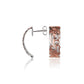 The photo shows a plumeria scroll stud earring with rose gold vermeil details. 