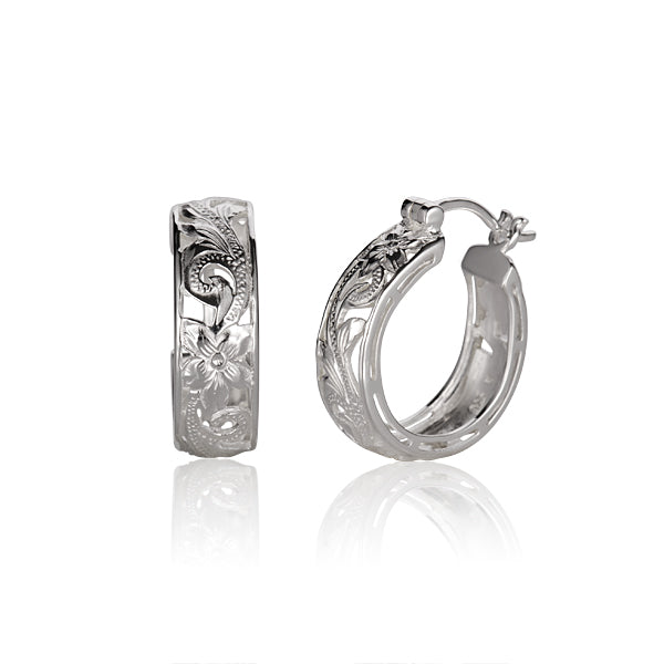 The photo shows a pair of sterling silver Hawaiian scroll cut-out hoop earrings. 