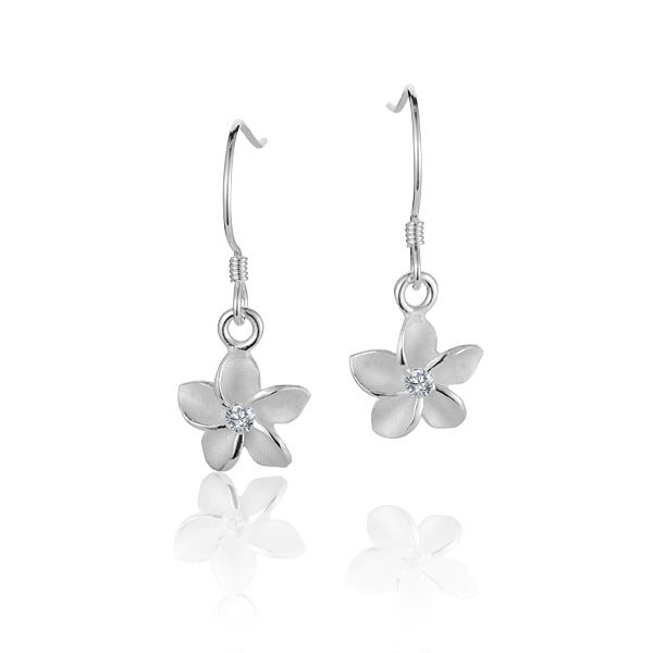 The photo shows a pair of sterling silver hook earrings featuring a plumeria design with cubic zirconia in the center. 