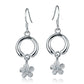 The photo shows a pair of circle dangle plumeria earrings with a sustainable clear cubic zirconia gem. 