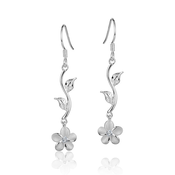 The photo shows a pair of sterling silver plumeria dangle leaf earrings with cubic zirconia.