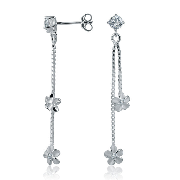 The photo shows a pair of sterling silver dangling plumeria earrings with cubic zirconia.