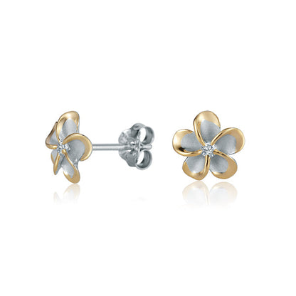 The photo shows a pair of yellow gold vermeil sterling silver rhodium plated plumeria stud earrings with cubic zirconia. 