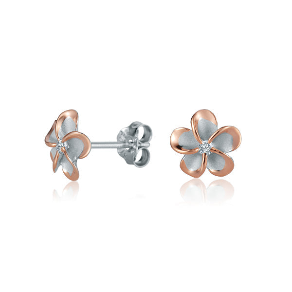 The picture shows a pair of rose gold vermeil sterling silver rhodium plated plumeria stud earrings with cubic zirconia. 