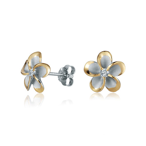 The photo show yellow gold vermeil sterling silver rhodium plated plumeria flower stud earrings with cubic zirconia stones in the center.  