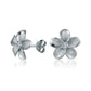 The photo show white gold vermeil sterling silver rhodium plated plumeria flower stud earrings with cubic zirconia stones in the center.  
