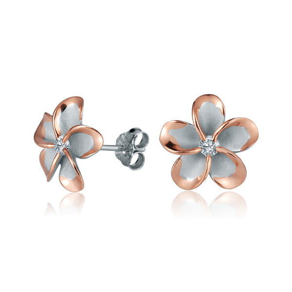 The photo show rose gold vermeil sterling silver rhodium plated plumeria flower stud earrings with cubic zirconia stones in the center.  