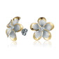 The photo show yellow gold vermeil sterling silver rhodium plated plumeria stud earrings with cubic zirconia gems.