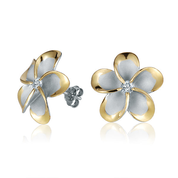The photo show yellow gold vermeil sterling silver rhodium plated plumeria stud earrings with cubic zirconia gems.