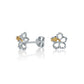 The photo is a pair of sterling silver hibiscus stud earrings with yellow gold vermeil details. 