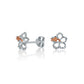 The photo is a pair of sterling silver hibiscus stud earrings with rose gold vermeil details. 