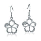 The picture is a pair of sterling silver hook hibiscus earrings with details in white gold vermeil and a clear eco-gem.