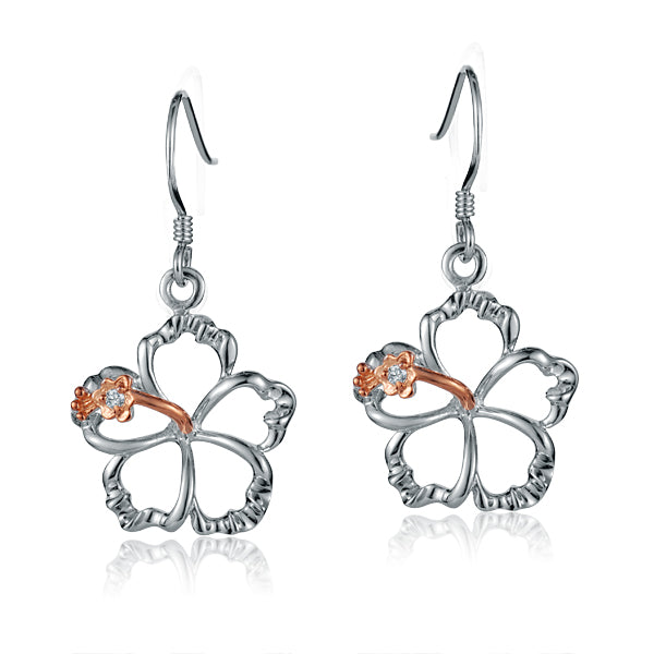 The photo shows a big size pair of sterling silver hook hibiscus earrings with details in rose gold vermeil and a clear eco-gem.