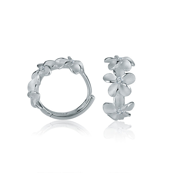 In the picture there is a pair of matte finish sterling silver plumeria hoop earrings with cubic zirconia. 