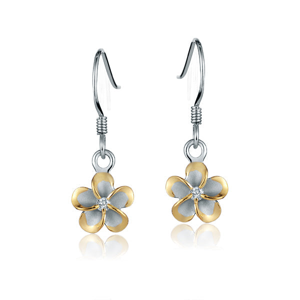 The photo shows a two-tone white and yellow gold vermeil plumeria hook earrings with cubic zirconia. 