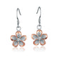 The photo show two-tone rose and white sterling silver rhodium plated plumeria hook earrings with cubic zirconia stones. 