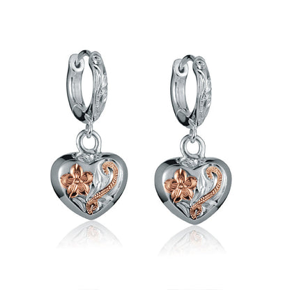 The photo is a two-tone rose and white gold vermeil scroll heart hoop earrings.