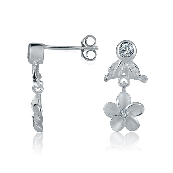 The photo shows a pair of sterling silver plumeria stud earrings with cubic zirconia. 