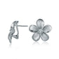 The photo shows a medium size of white gold vermeil and sterling silver rhodium plated plumeria clip earrings with cubic zirconia. 