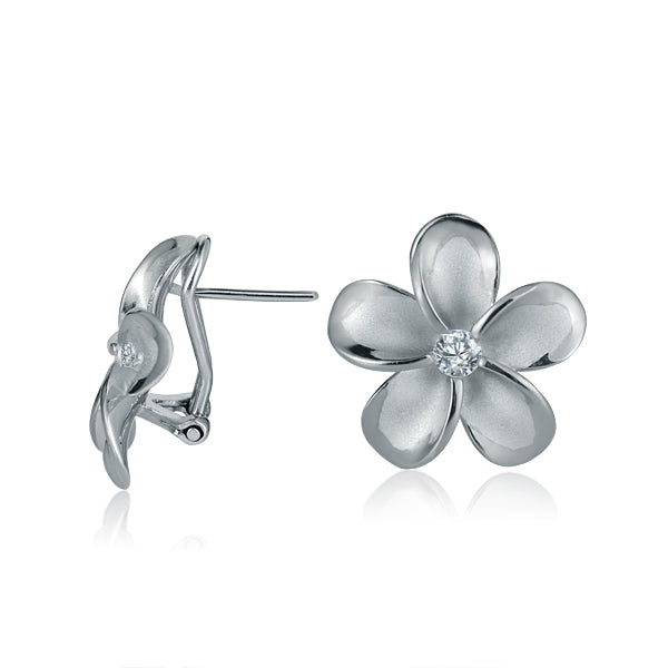 The photo shows a medium size of white gold vermeil and sterling silver rhodium plated plumeria clip earrings with cubic zirconia. 