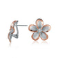 The photo shows a medium size of rose gold vermeil and sterling silver rhodium plated flower clip earrings with cubic zirconia gems.